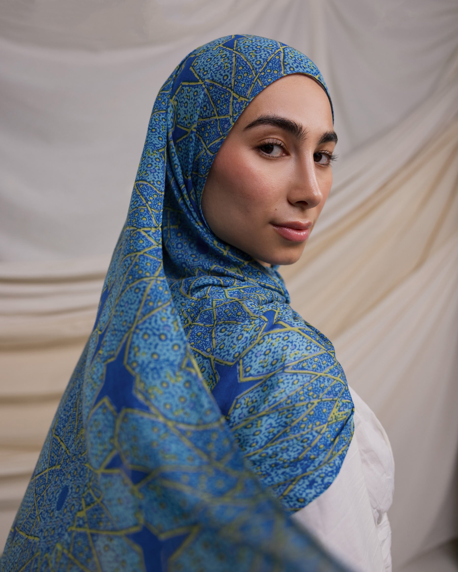 Instant hijab featuring hand-printed Islamic patterns inspired by Afghan architecture.