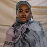 Watercolor-style hijab in calming tones, made from smooth and breathable modal fabric.