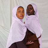 Two Models wearing soft woven hijab with a fresh, seasonal tone and a light, comfortable drape