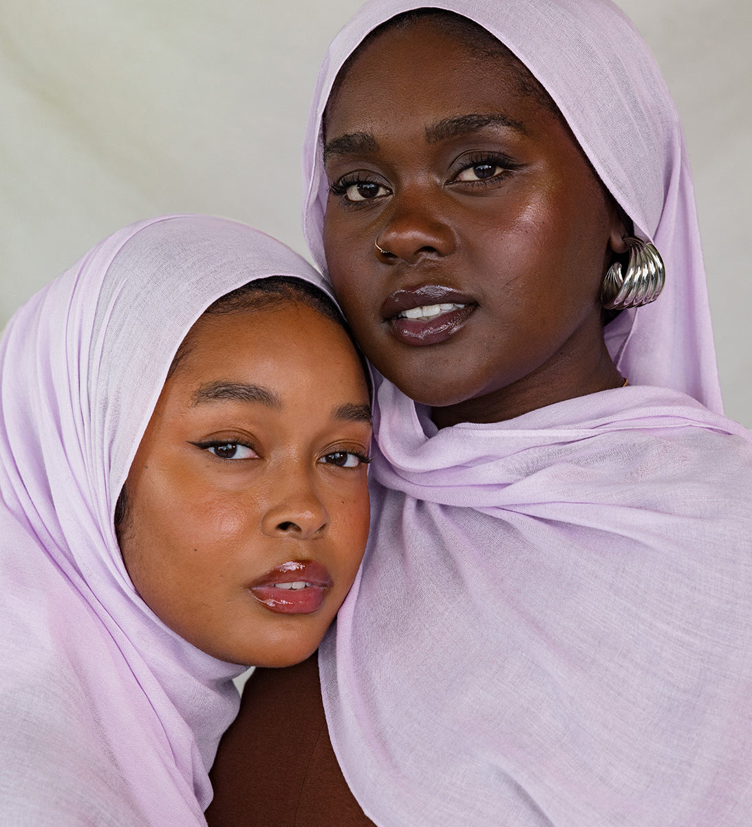 Two Models wearing a soft and bold modal hijab, hand-dyed and perfect for seasonal layering