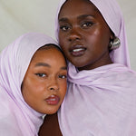 Two Models wearing a soft and bold modal hijab, hand-dyed and perfect for seasonal layering