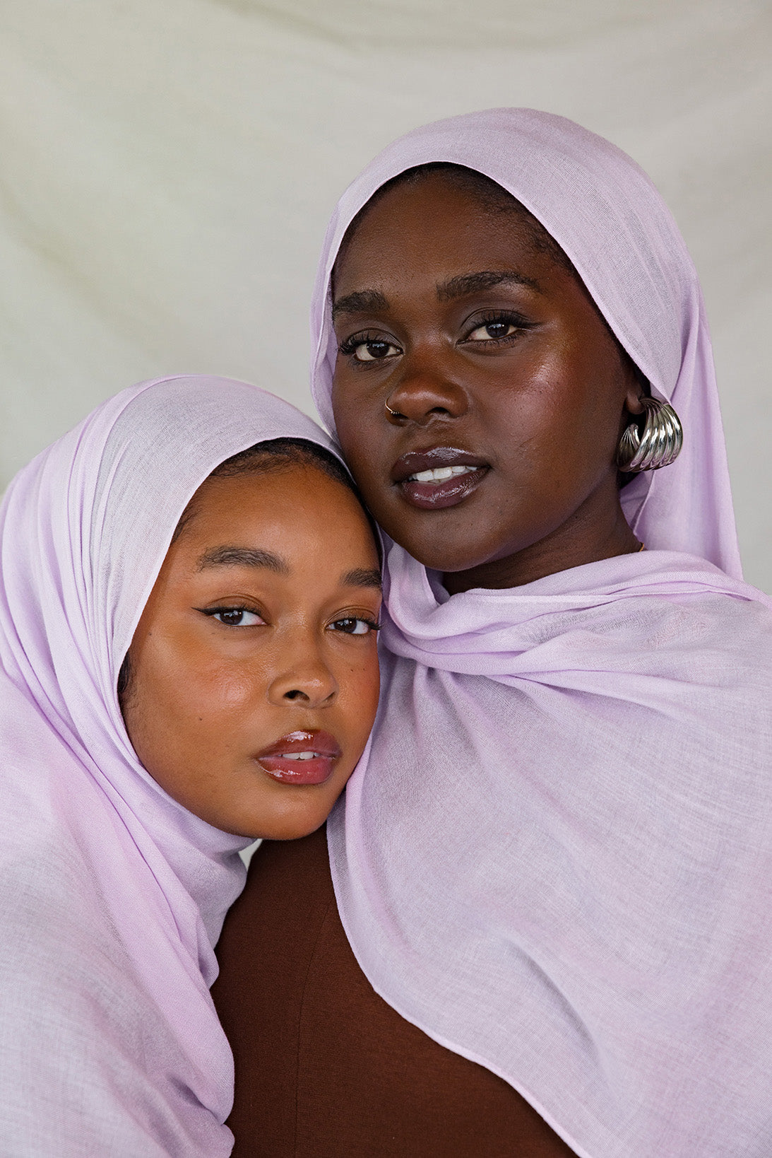 Two Models wearing a soft and bold modal hijab, hand-dyed and perfect for seasonal layering