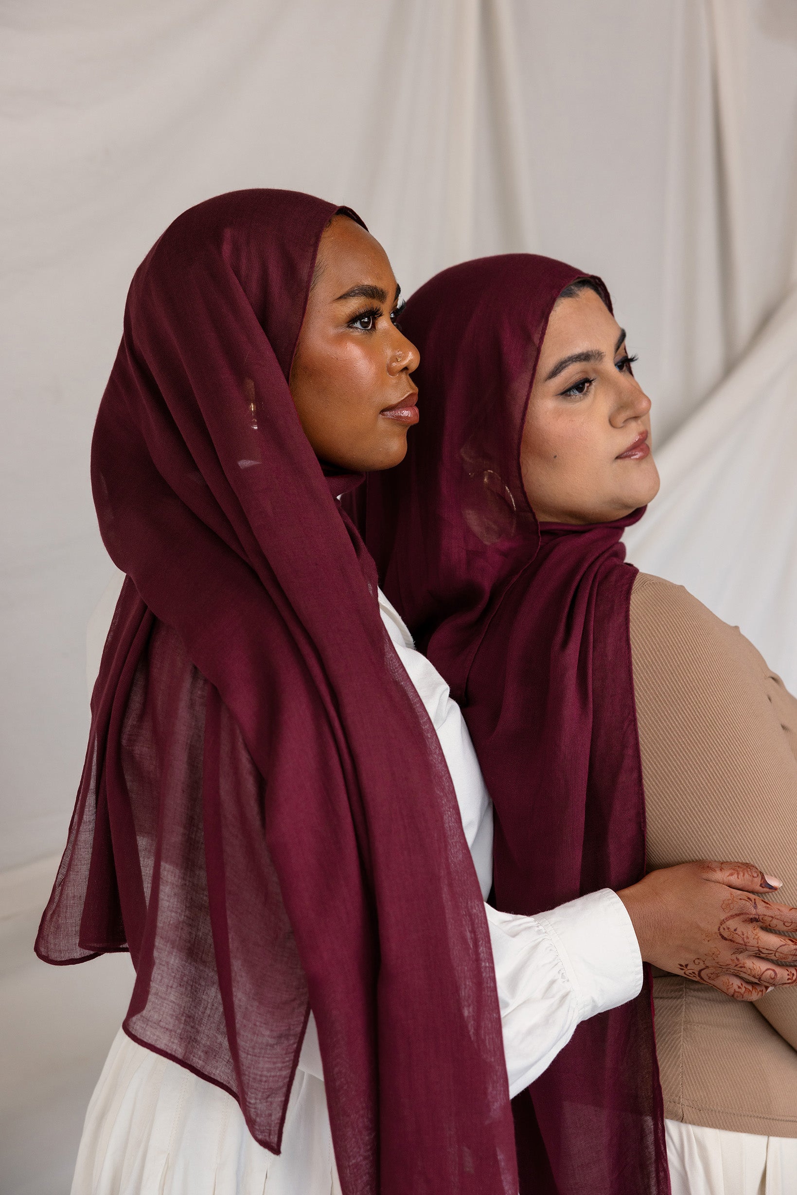 Models in angled poses wearing the Maroon hijab, showcasing different styling perspectives in coordinated outfits.