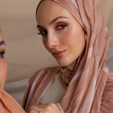 Printed hijab with soft flowing pattern and timeless texture, crafted in breathable fabric