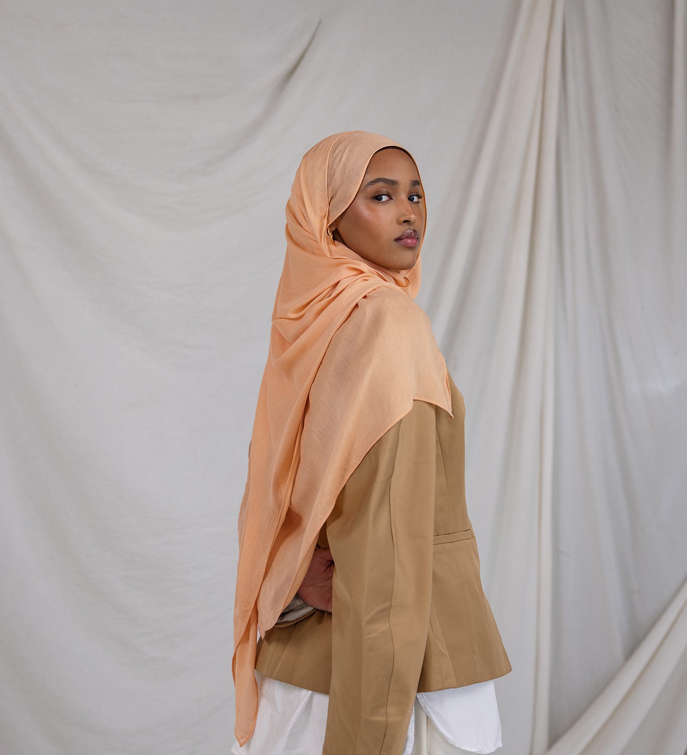Golden Hour modal hijab by VELA, capturing the soft glow of evening light in a breathable summer weave.