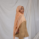 Golden Hour modal hijab by VELA, capturing the soft glow of evening light in a breathable summer weave.