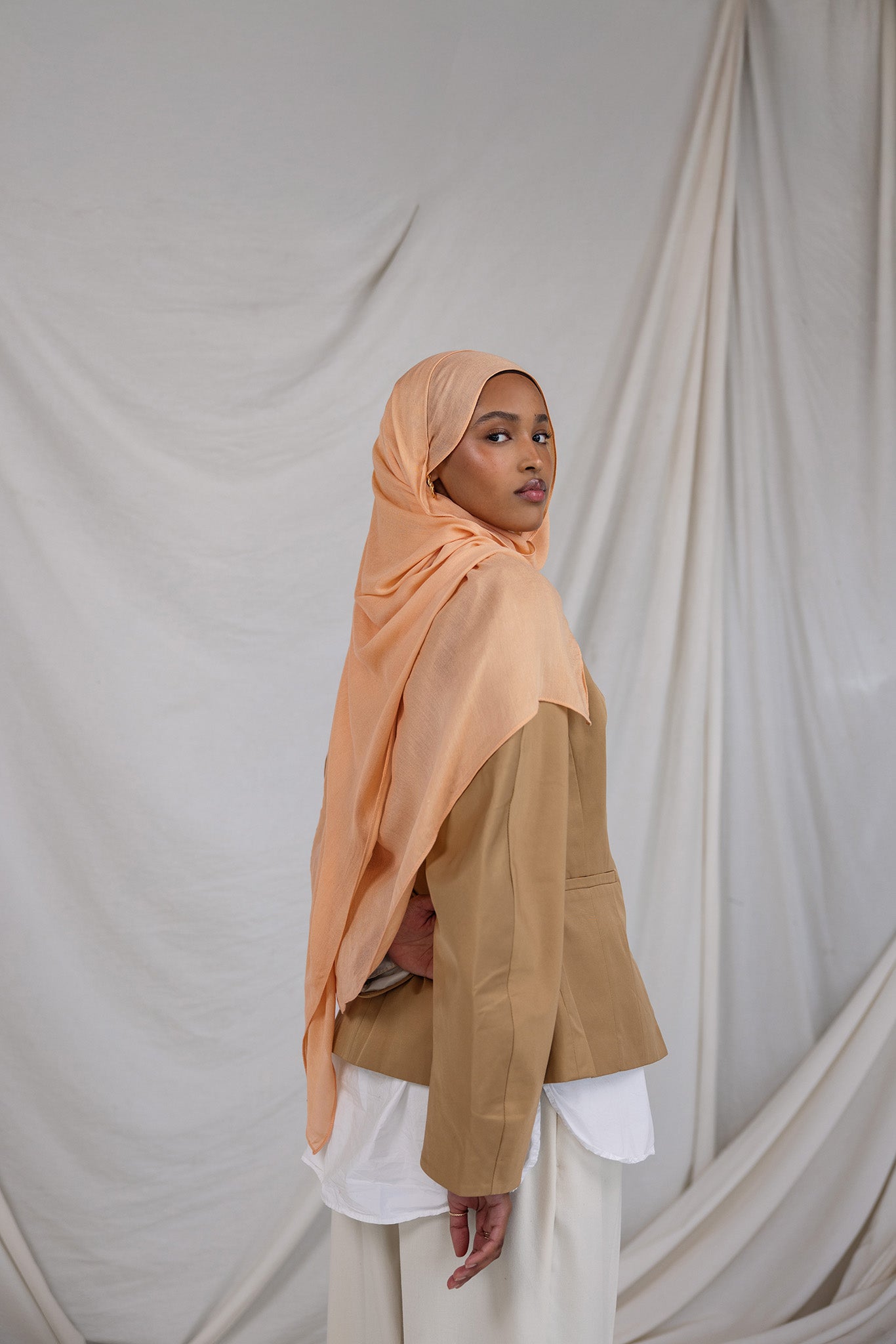 Golden Hour modal hijab by VELA, capturing the soft glow of evening light in a breathable summer weave.