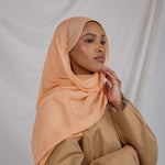 An ember-toned scarf that channels late-day light, Golden Hour adds instant warmth to any outfit