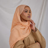 An ember-toned scarf that channels late-day light, Golden Hour adds instant warmth to any outfit