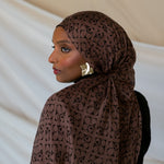 Model wearing brown Art Deco styled print hijab.
