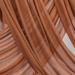 Cinnamon-toned modal hijab by VELA, bringing cozy energy and subtle strength to your wardrobe staples.