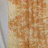 VELA hijab with grounded floral tones and natural movement.
