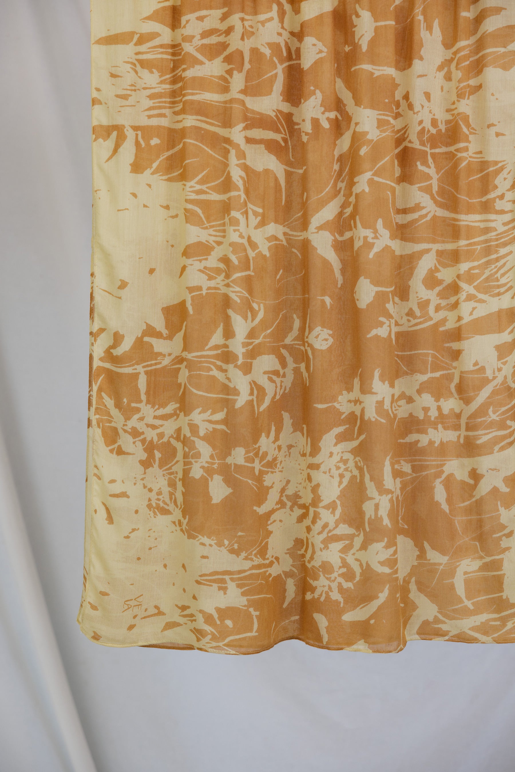 VELA hijab with grounded floral tones and natural movement.