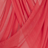 Close-up of pink coral hijab with a draped effect