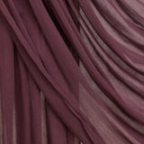 Rosewood hijab being draped in front of backdrop.