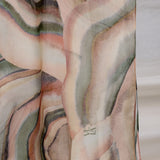 woven modal hijab featuring a colorful sediment design with natural fluidity.
