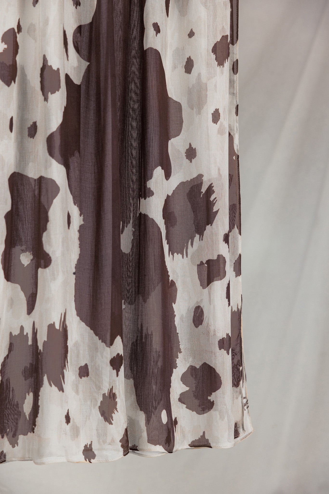 Close-up product shot of Prairie Hide, showcasing it's cream base and brown randomized splotches like a cow hide.