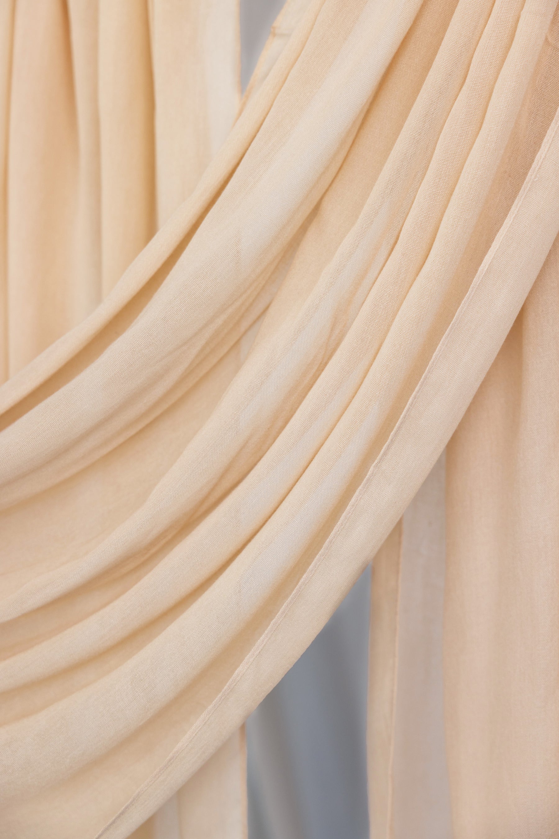 A neutral-toned VELA hijab in Sand, designed to offer breathable ease and understated elegance