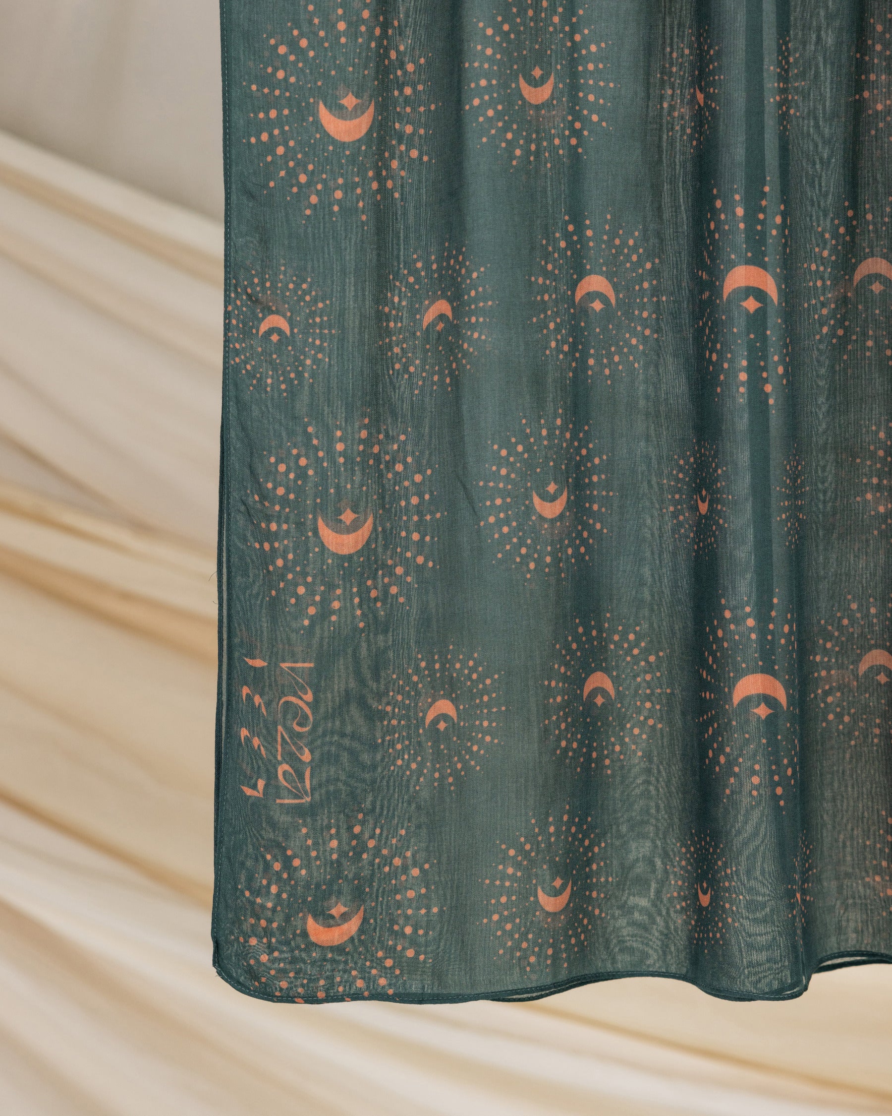 VELA’s Teal Crescents hijab, blending subtle lunar accents with breathable fabric for everyday wear