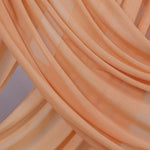 This Golden Hour hijab brings the burnt-gold brilliance of sunset to a clean, modern silhouette