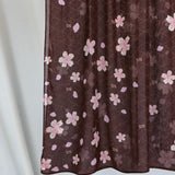 A product image showing a brown hijab printed with pink and white cherry blossoms.