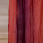 VELA hijab with a soft color blend from deep red to pink, light and comfortable to wear.