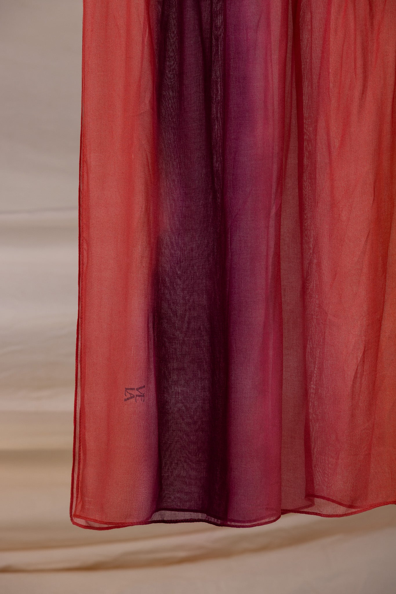 VELA hijab with a soft color blend from deep red to pink, light and comfortable to wear.