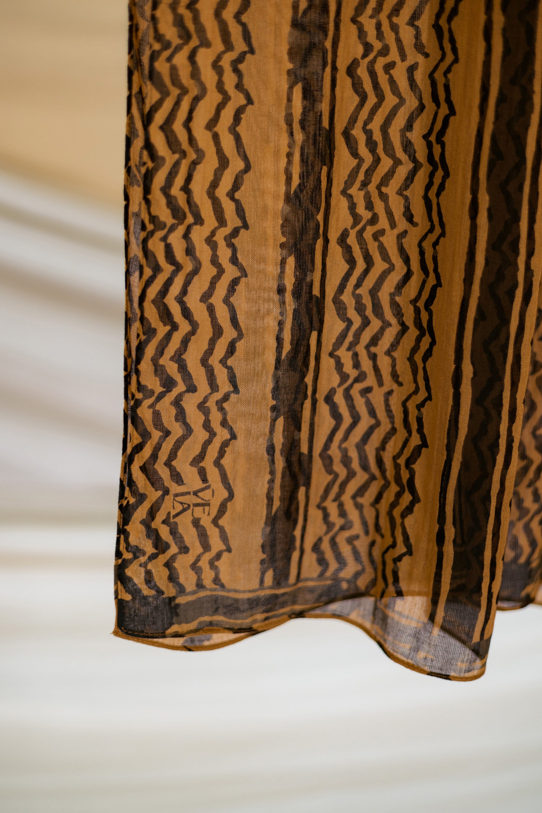 heritage-style hijab with soft woven texture and updated cultural print.