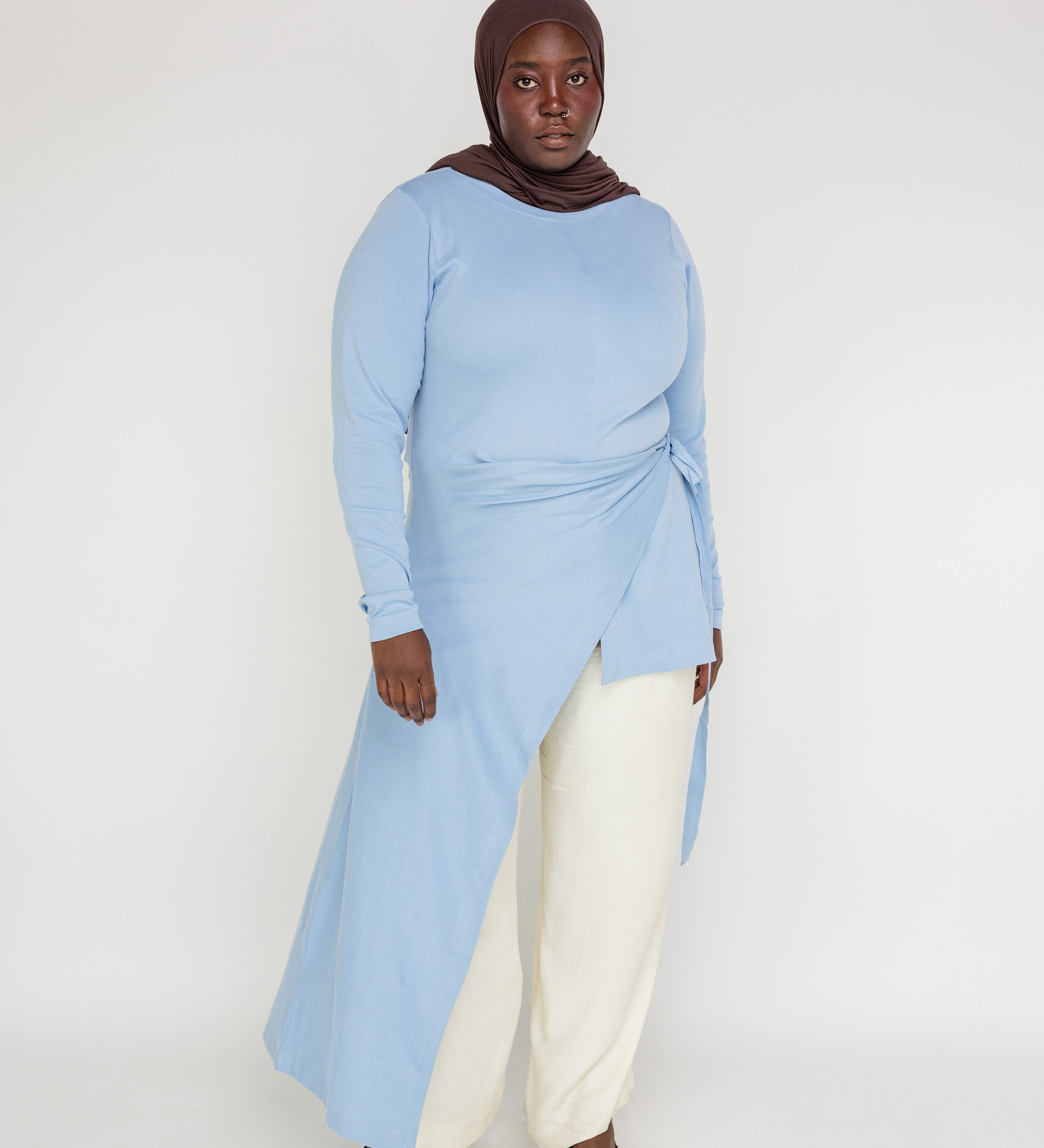 Modest high-low top crafted for comfort, coverage, and all-day versatility