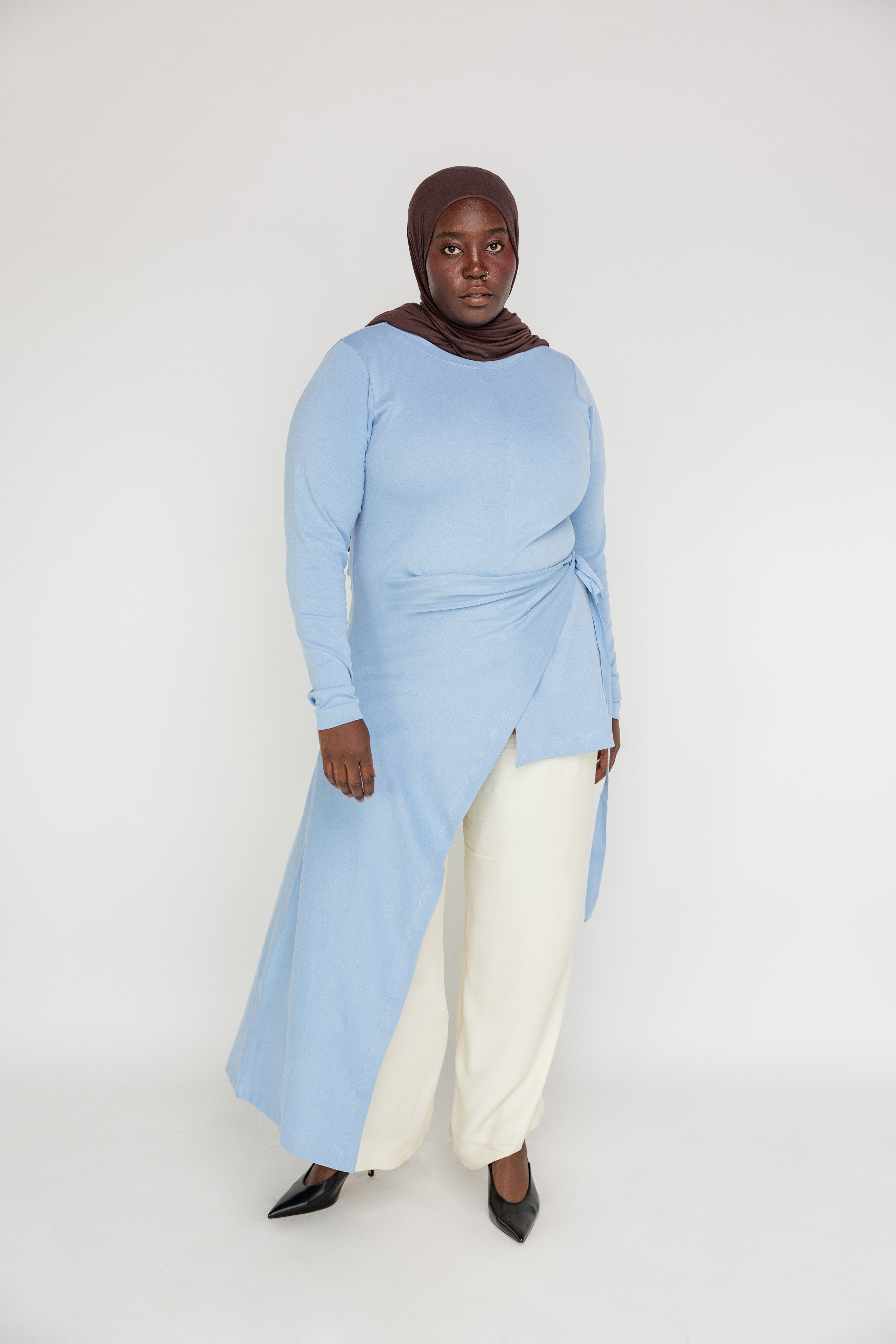 Modest high-low top crafted for comfort, coverage, and all-day versatility