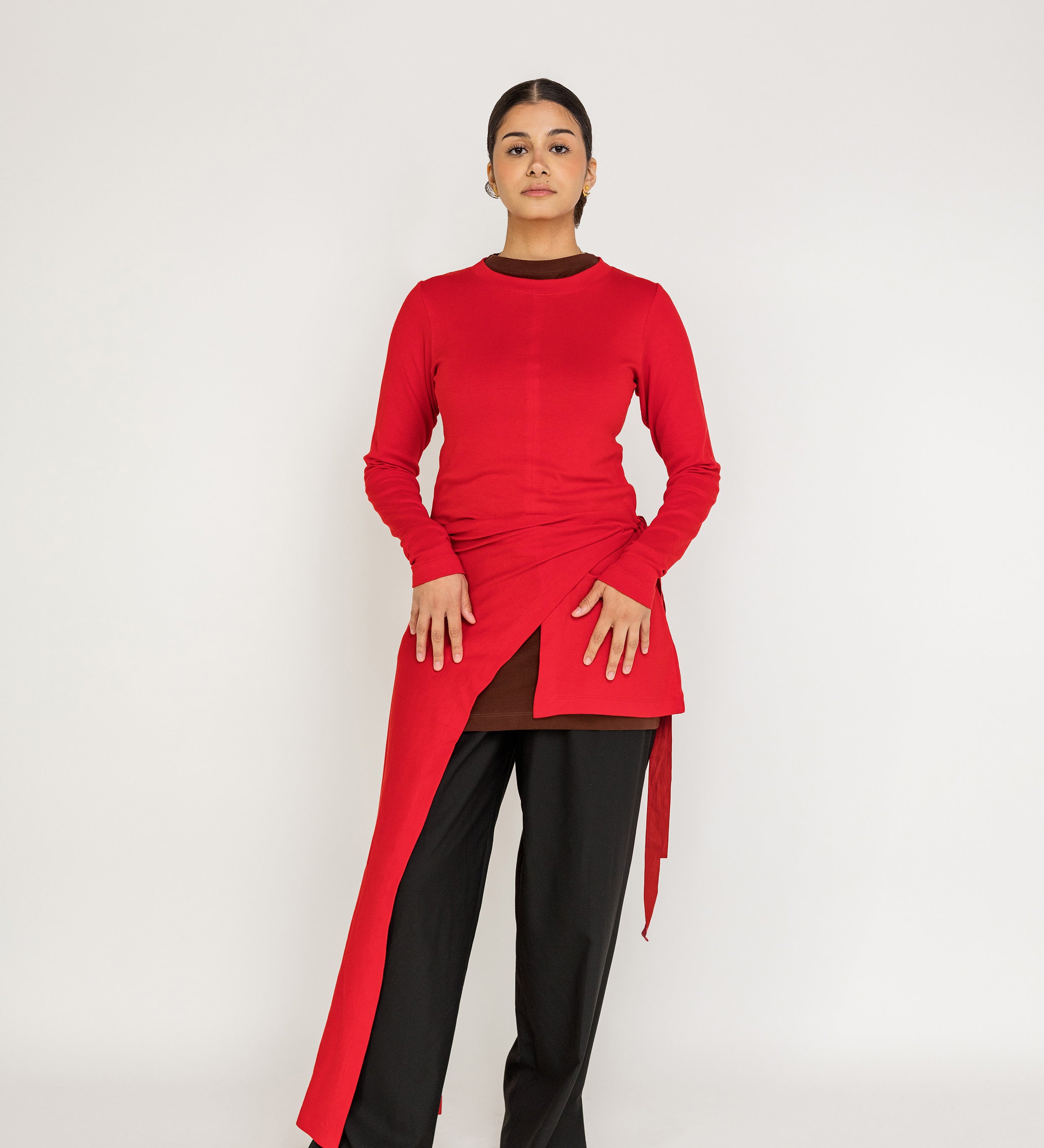 Loose-fit top designed for layering, with a flowing high-low silhouette