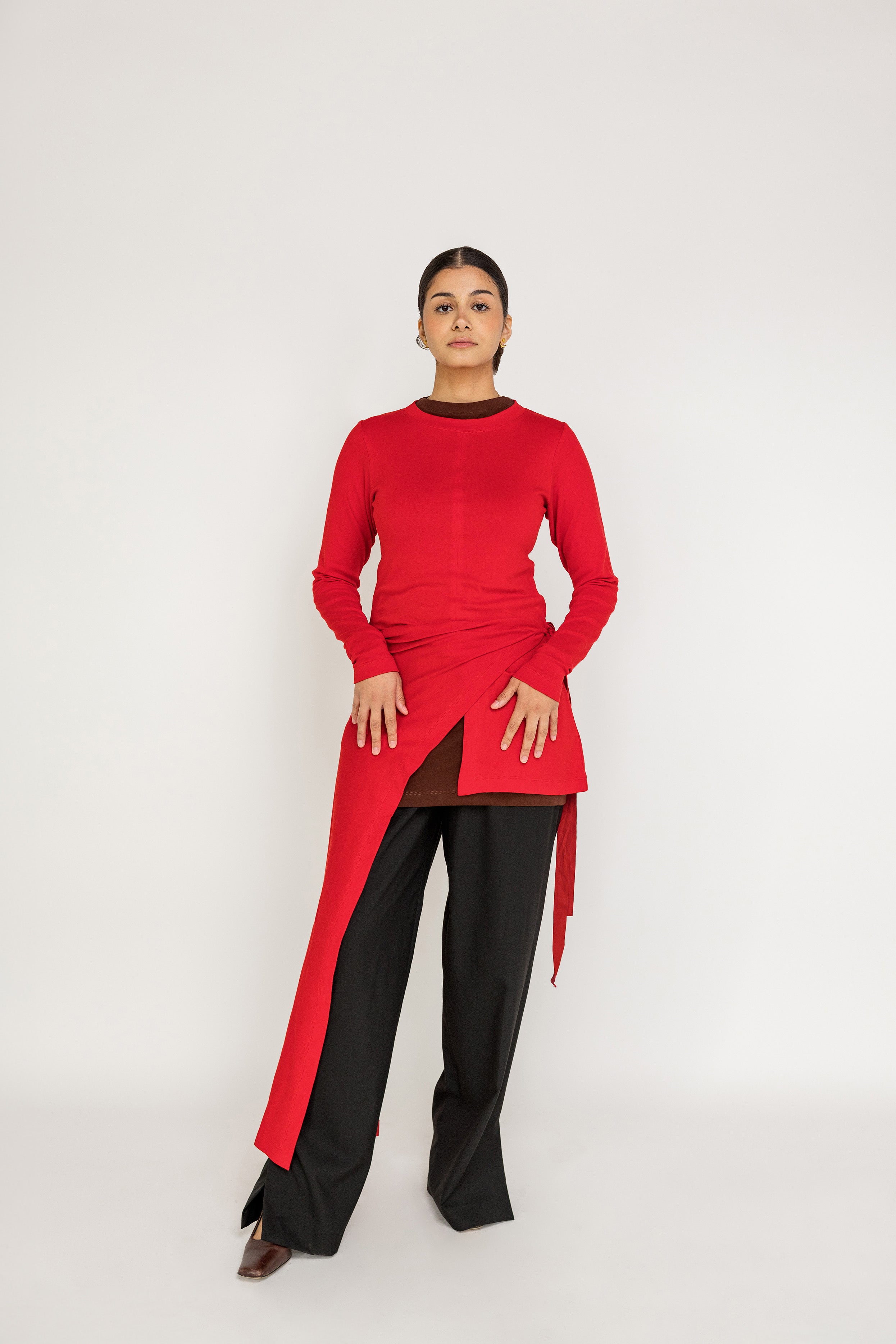 Loose-fit top designed for layering, with a flowing high-low silhouette