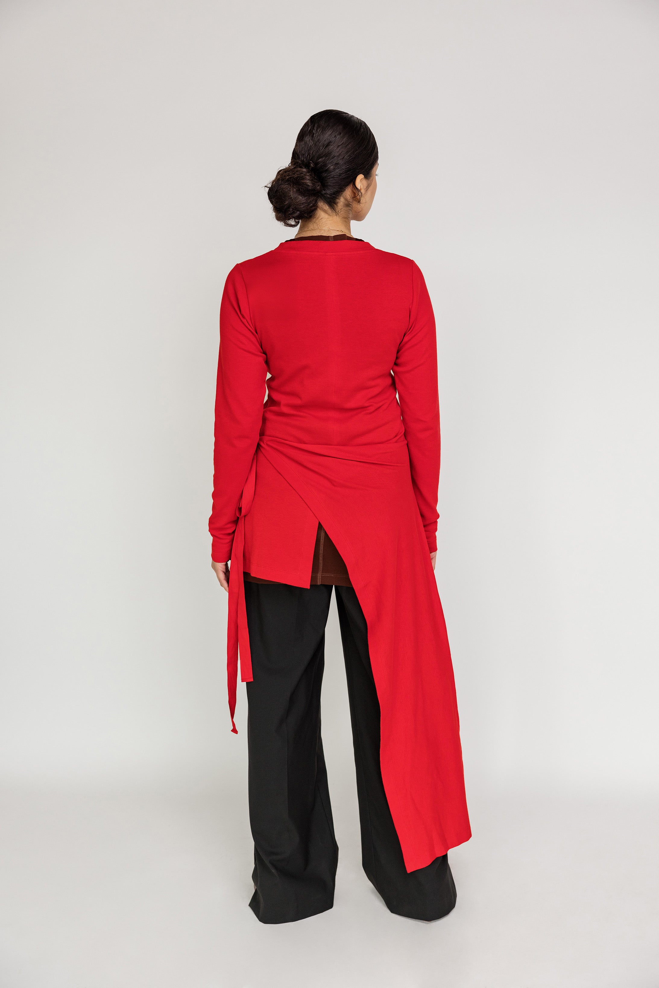 Sleek and simple high-low top offering light coverage and gentle drape for daily wear