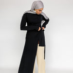 Capsule wardrobe top with a smooth finish and slightly longer back hem