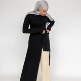 Capsule wardrobe top with a smooth finish and slightly longer back hem