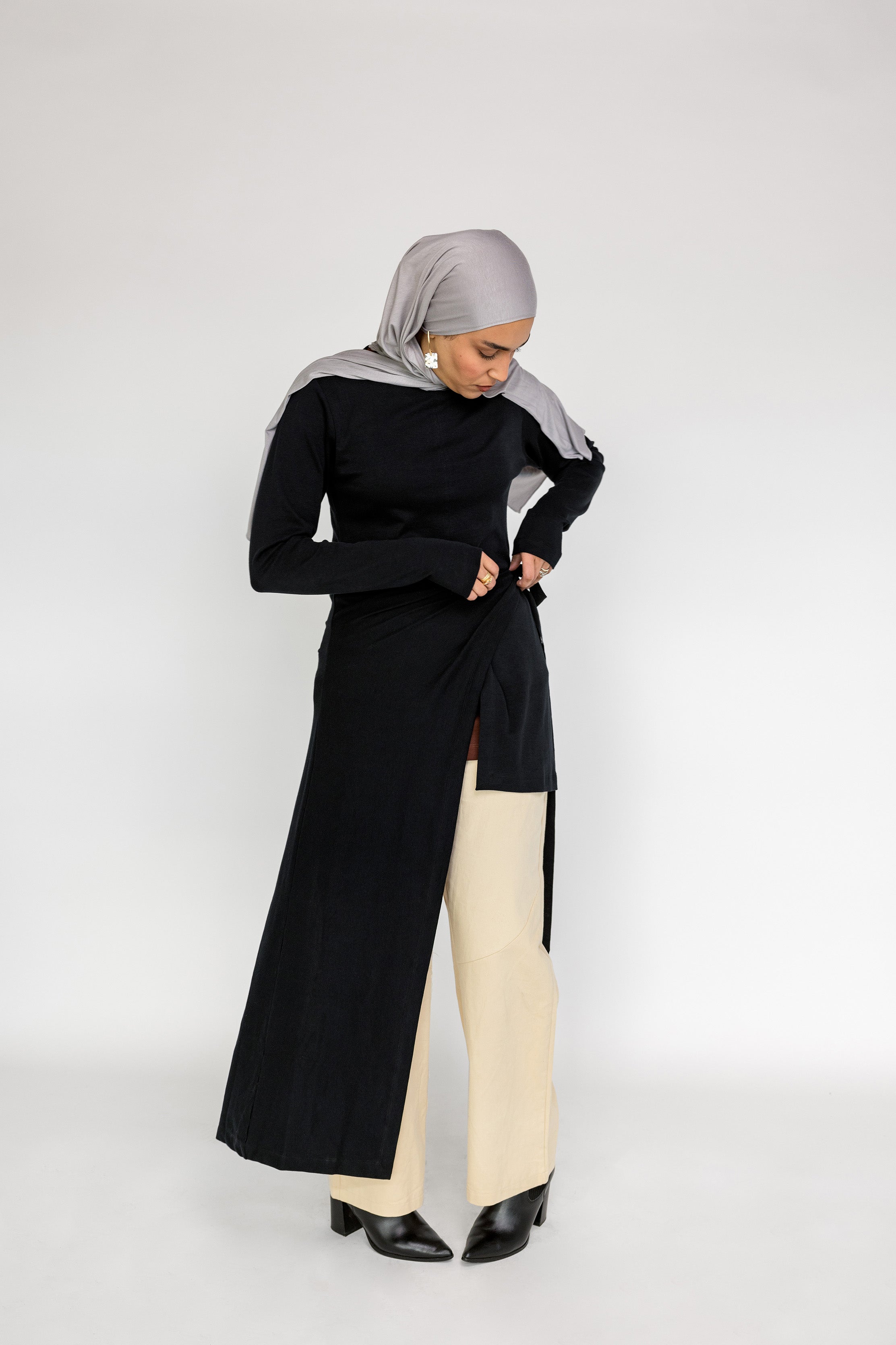 Capsule wardrobe top with a smooth finish and slightly longer back hem