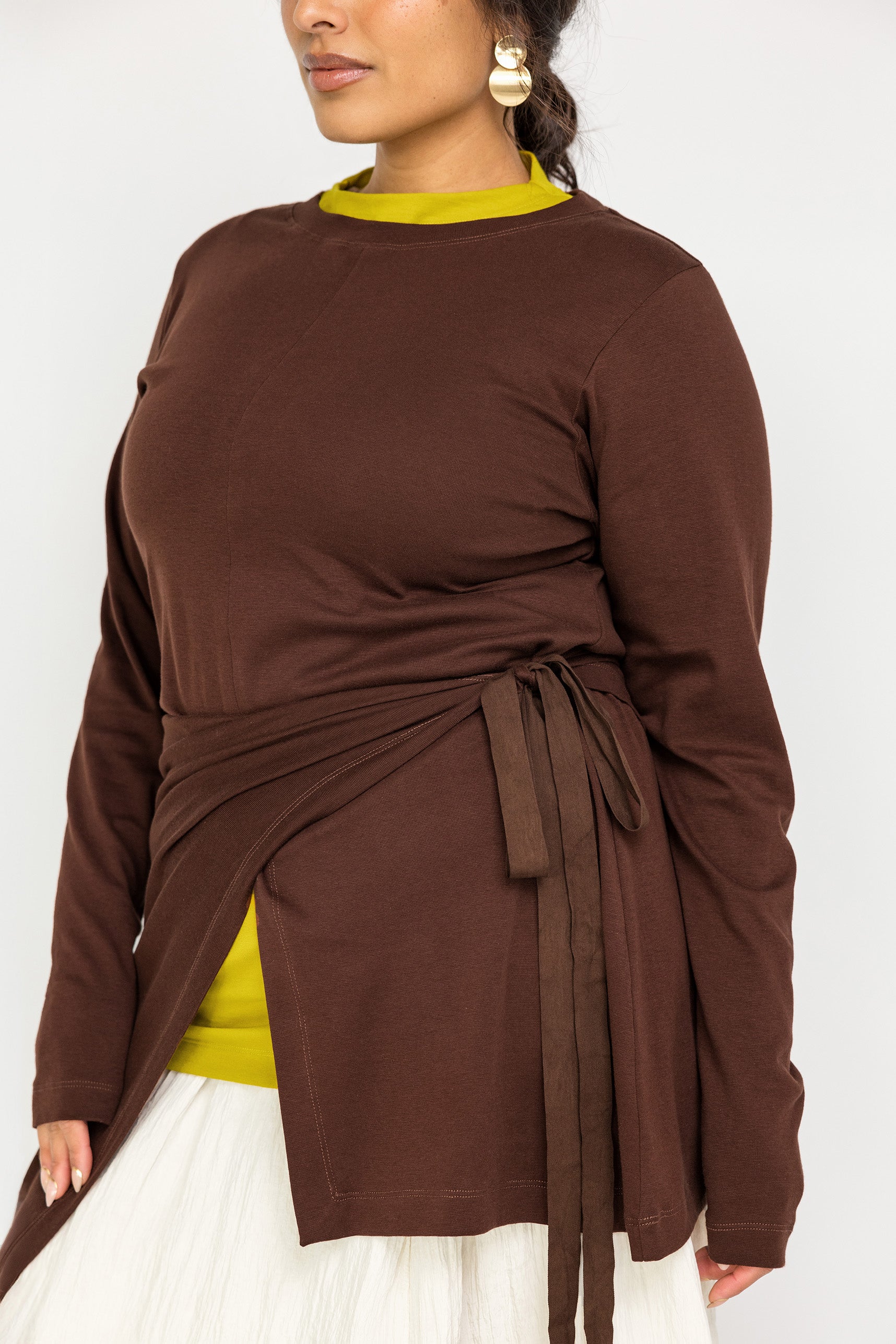 Modest long-sleeve top with a modern high-low cut and relaxed, airy shape