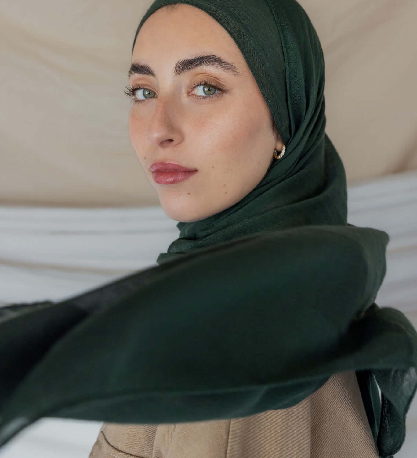 Model wearing soft modal hijab with a deep, earthy tone and smooth, breathable texture