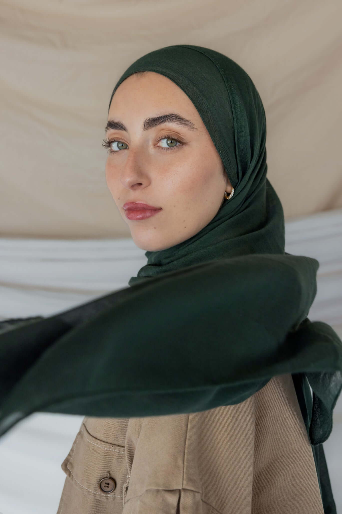Model wearing soft modal hijab with a deep, earthy tone and smooth, breathable texture