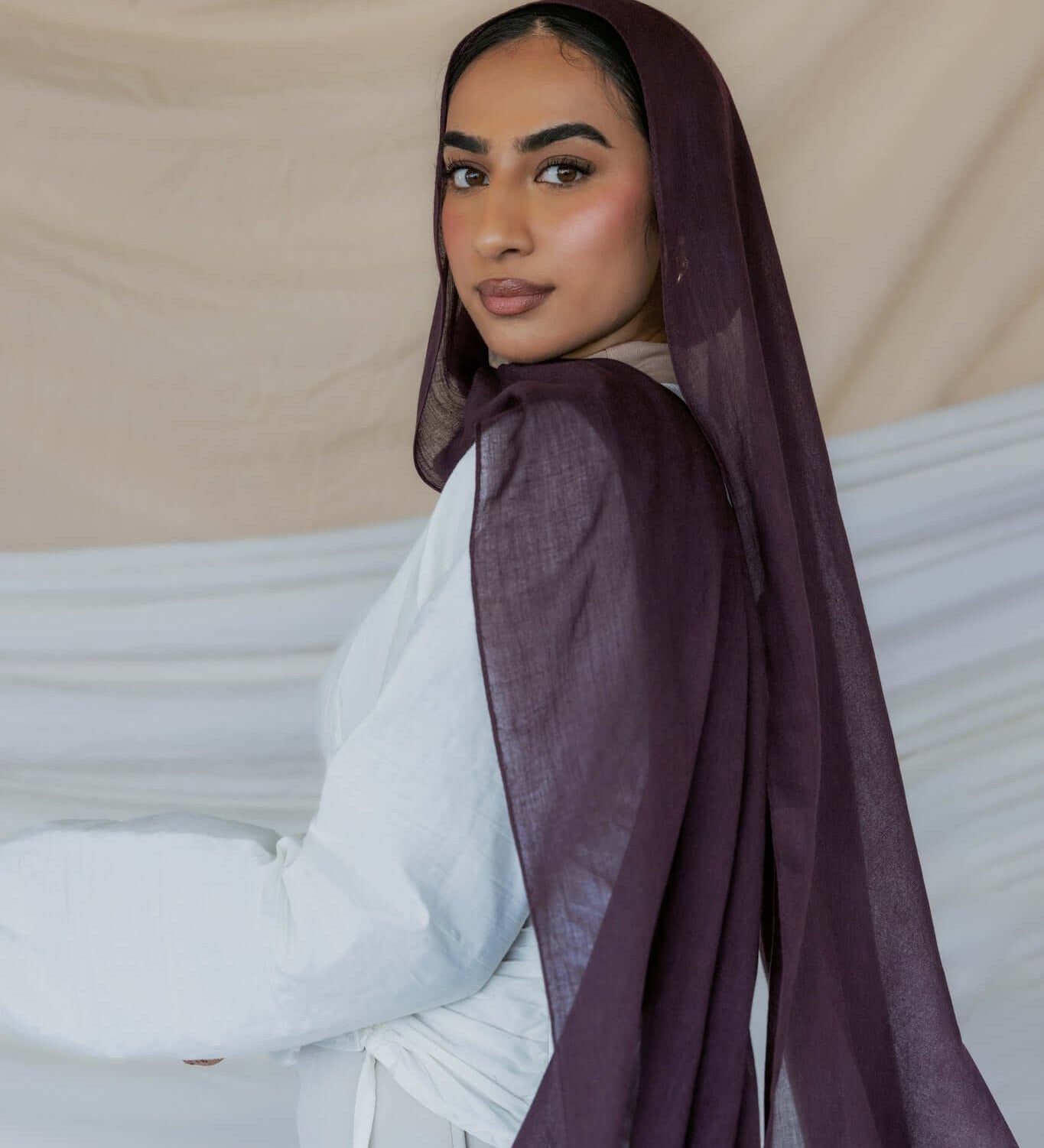 Model wearing soft modal hijab with a rich, layered tone and smooth drape.