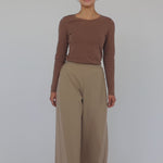 Comfortable full-length pants with wide legs and neat front pleats.
