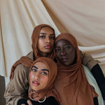 Three Models wearing bamboo hijab in a balanced light brown tone with soft, cushy texture.