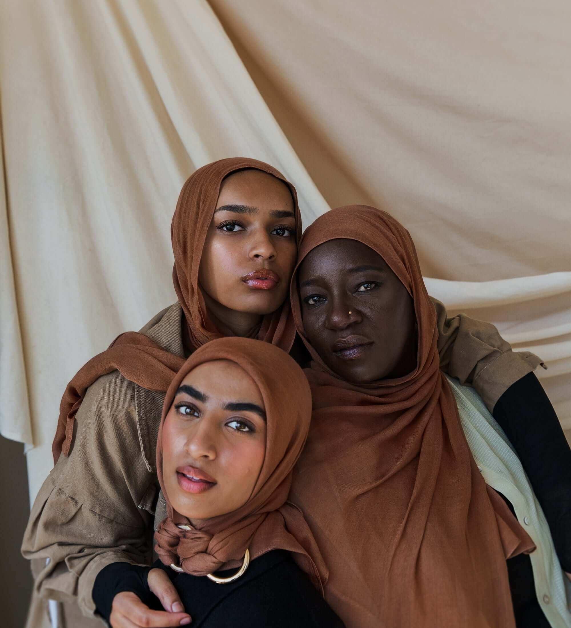 Three Models wearing bamboo hijab in a balanced light brown tone with soft, cushy texture.
