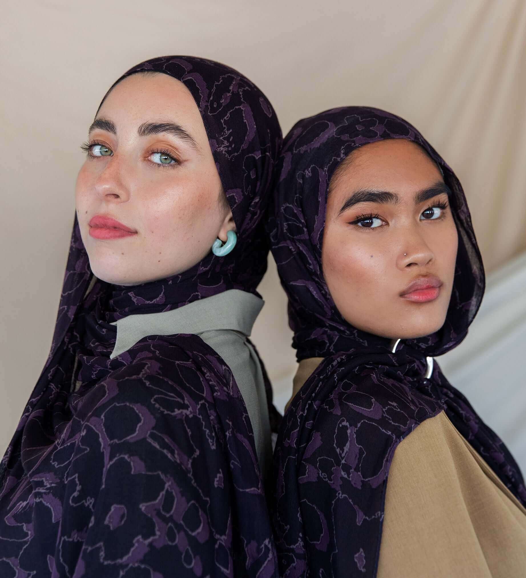 Modal hijab with abstract floral accents and a softly dramatic finish.