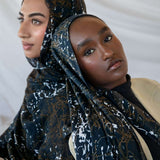 Modal hijab featuring a moody abstract design with organic movement and texture.