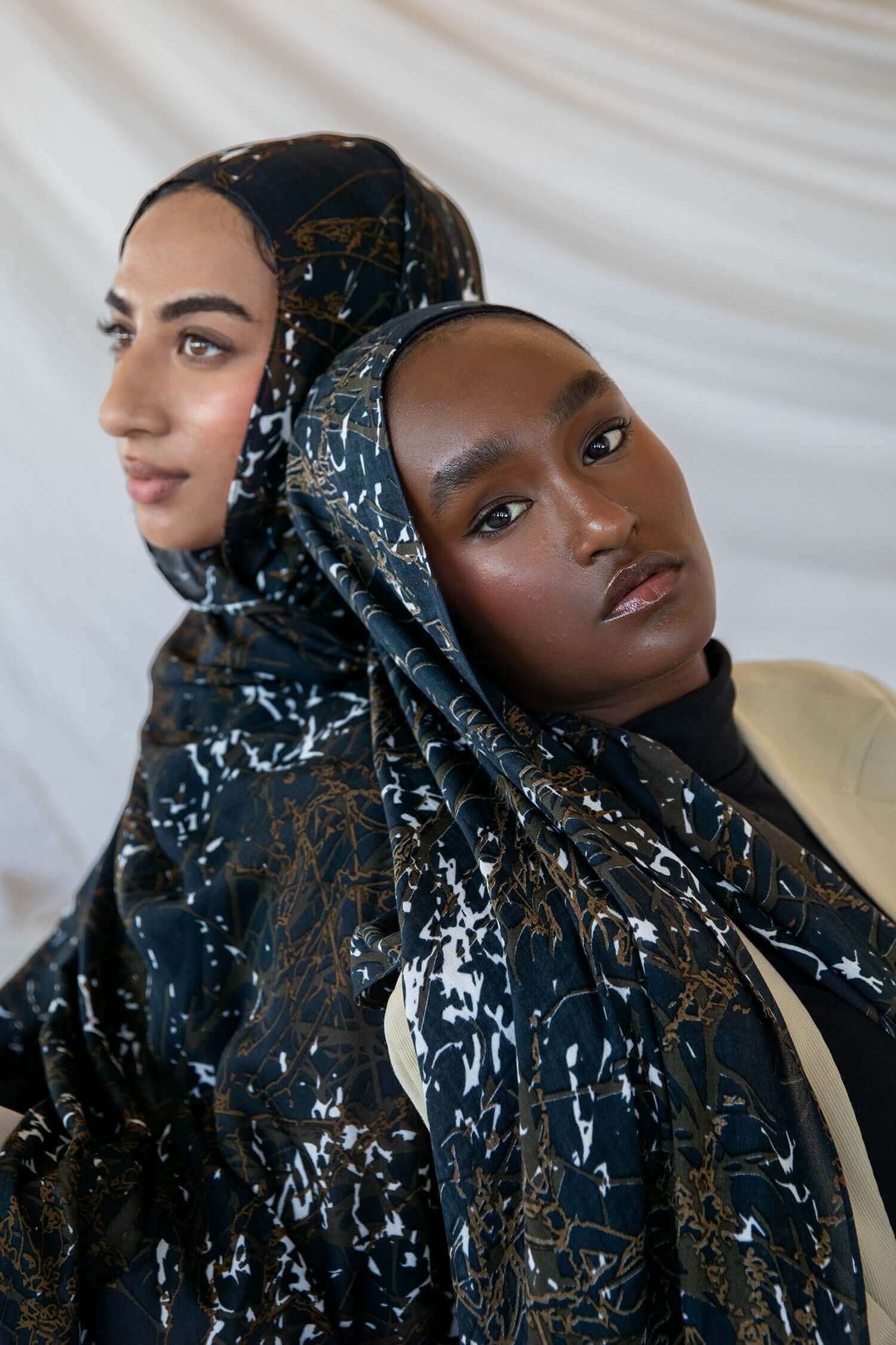 Modal hijab featuring a moody abstract design with organic movement and texture.