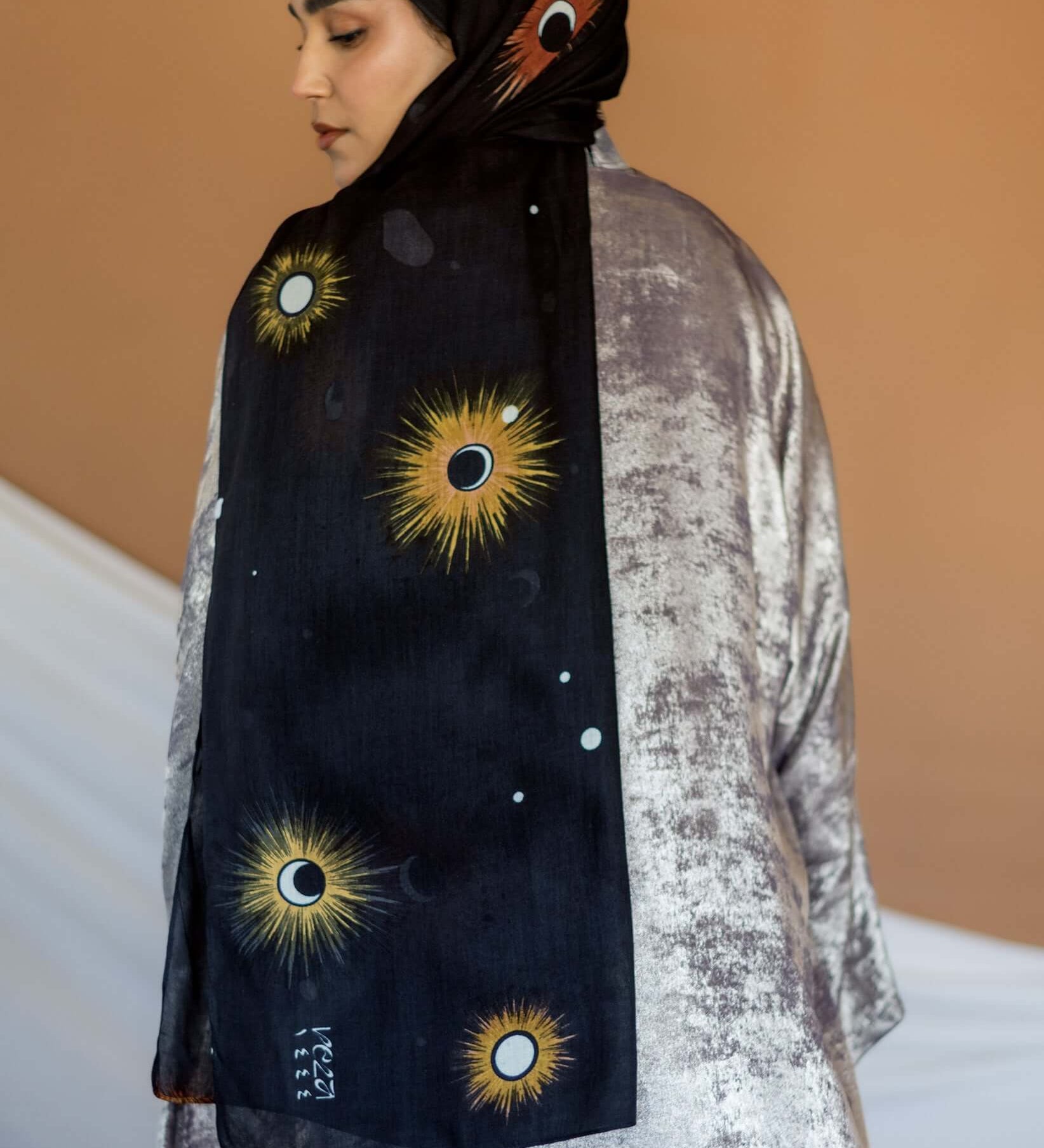 Woven modal hijab featuring a moon phase design inspired by peaceful Ramadan nights.