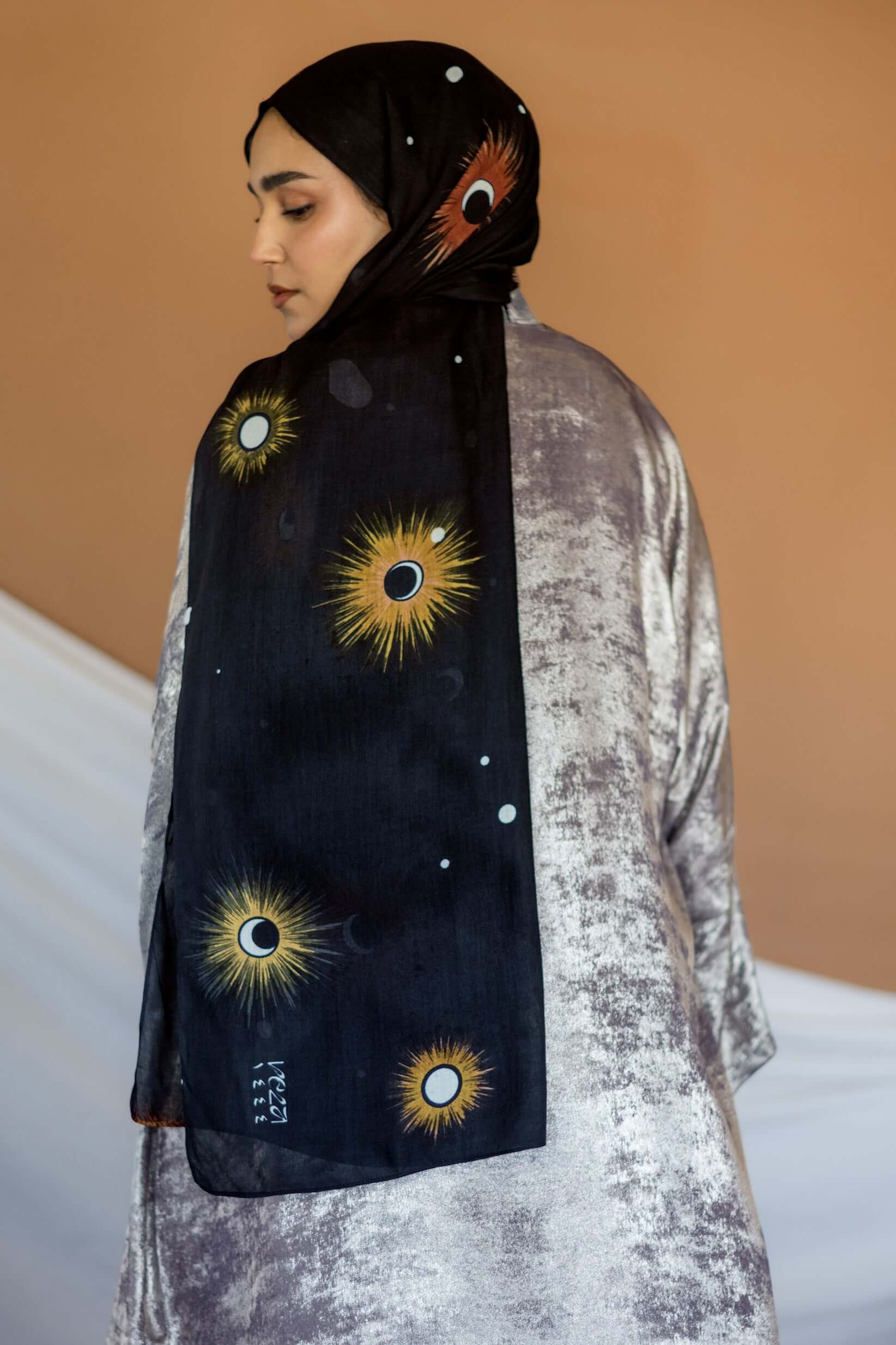 Woven modal hijab featuring a moon phase design inspired by peaceful Ramadan nights.