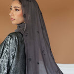 Celestial print hijab designed with subtle lunar accents and breathable woven texture