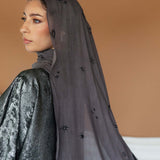 Celestial print hijab designed with subtle lunar accents and breathable woven texture